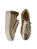 gold trainers online
