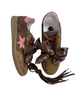 Brown sneakers with a pink star and brown laces meline