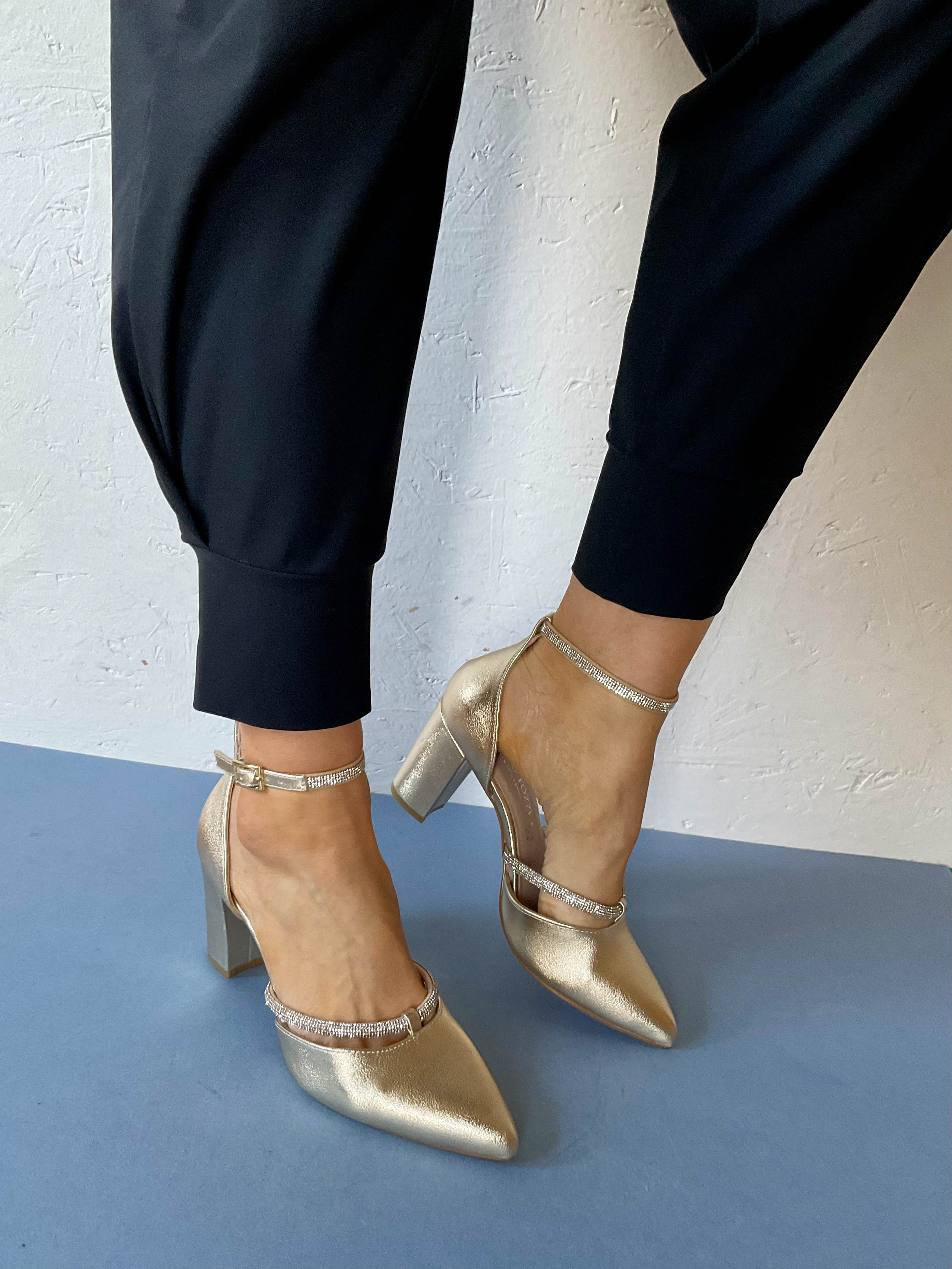 gold high heel shoes