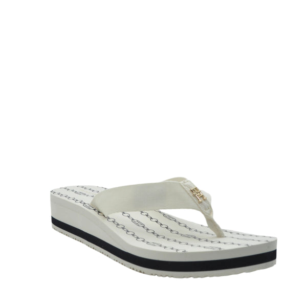 white tommy flip flops