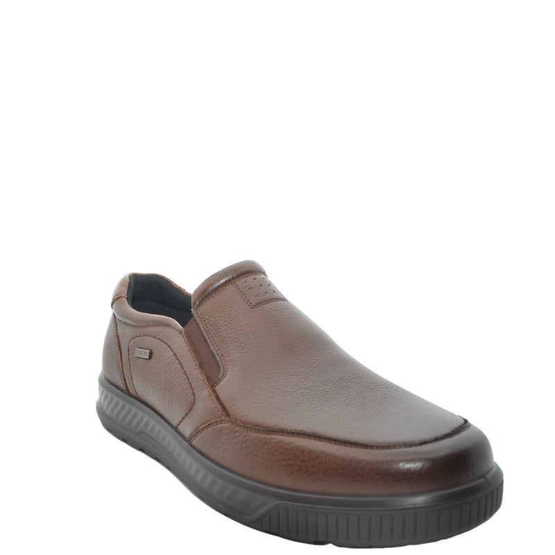 Load image into Gallery viewer, A single brown leather slip-on shoe with a dark gray sole, photographed from a three-quarters angle on a white studio background.
