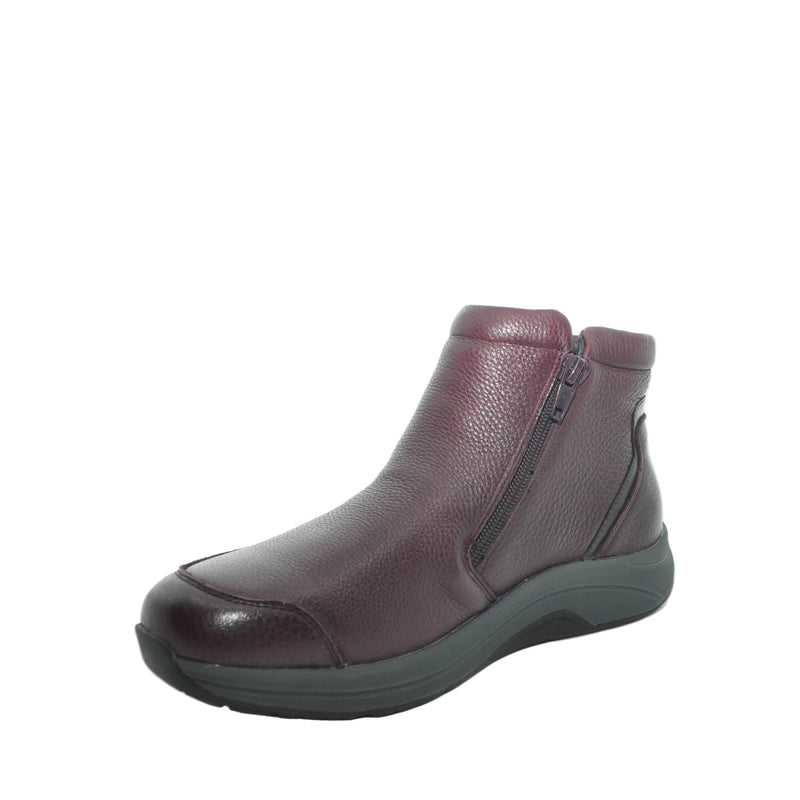 Load image into Gallery viewer, A single women's ankle boot in dark burgundy pebbled leather with a side zipper and a thick black sole, shown from a three-quarters angle on a white background.
