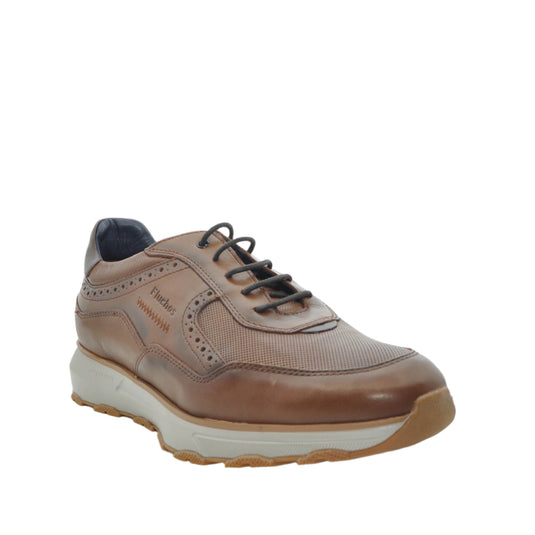 Brown shoe with white sole 