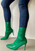 Una heal;y green high heel boots